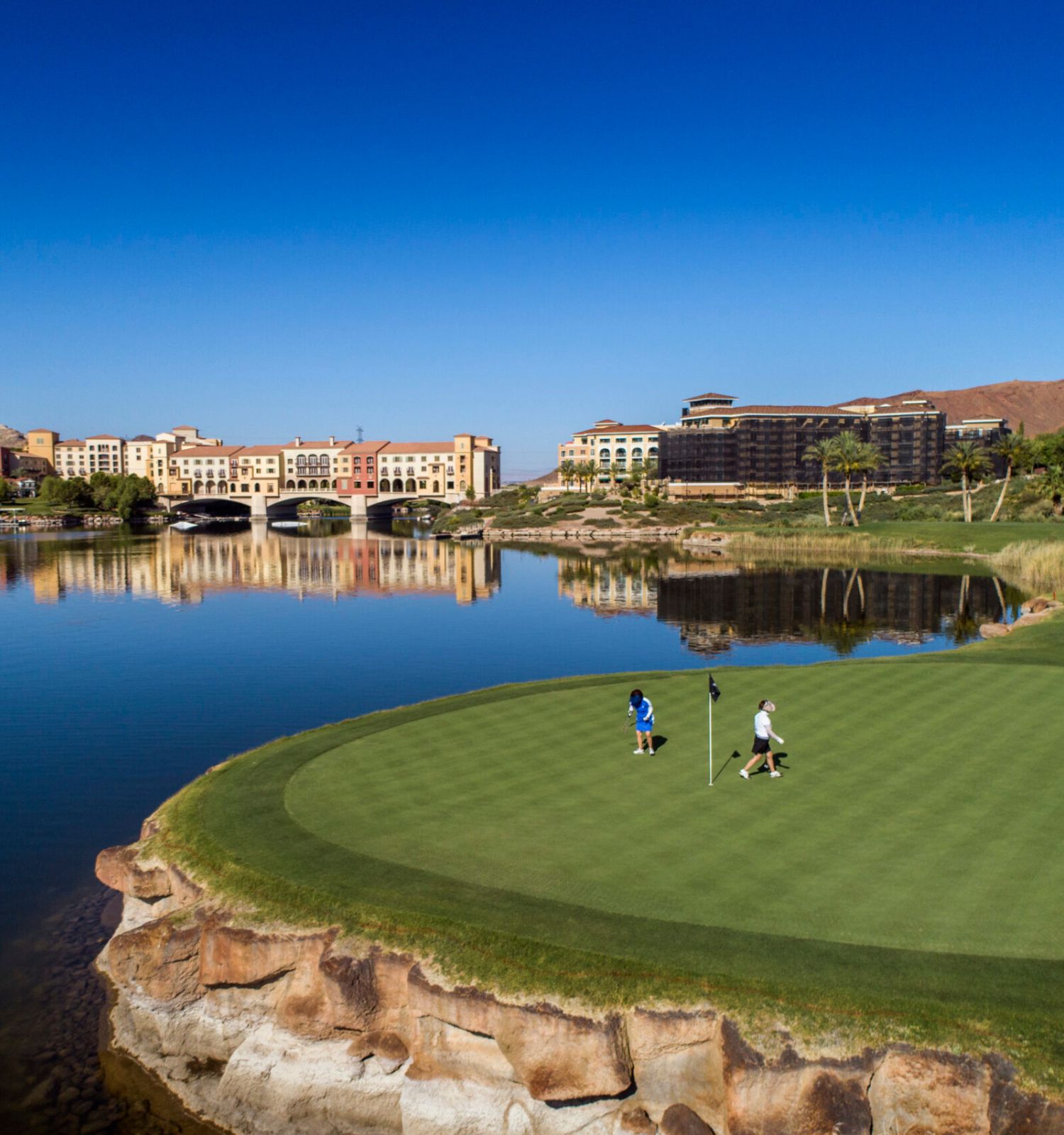 Golfers golfing on the greens at Reflection bay Golf Club at Lake Las Vegas